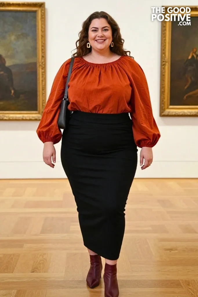 Rust Smock Blouse With Sculptural Black Midi Skirt